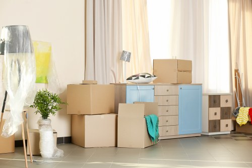 Removal team assisting a local move in Peckham with boxes and furniture