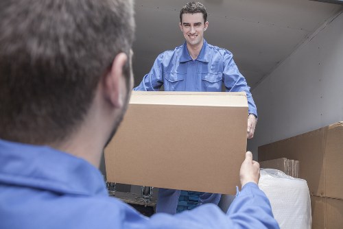 Team reviewing ethical compliance documents for Man With Van Peckham
