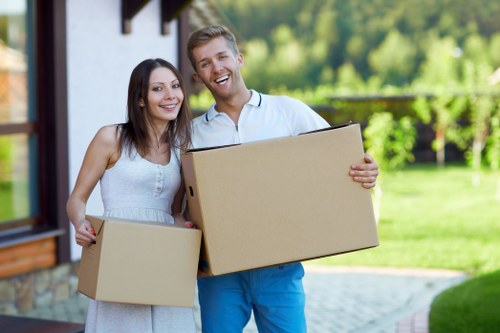 Packed boxes and furniture ready for a removal van service