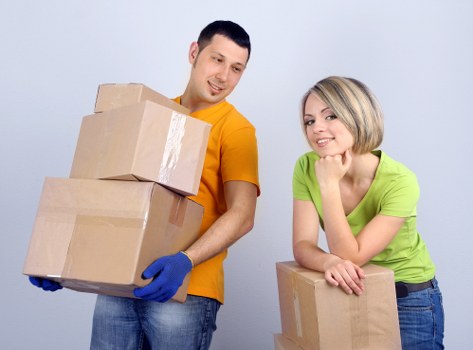 Packed boxes and furniture ready for transport in a Peckham property