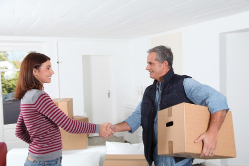 Packed boxes and furniture ready for man with van removal in Peckham