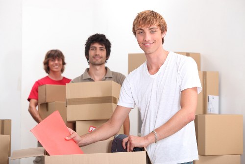 Professional movers handling furniture in a Peckham flat