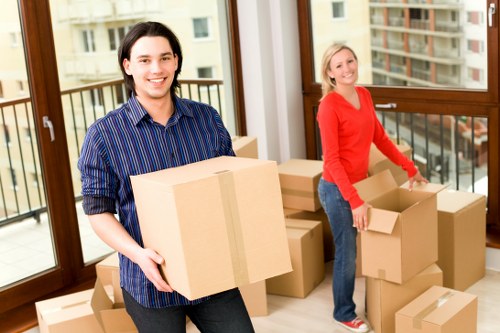 Professional moving team in Peckham handling furniture with care