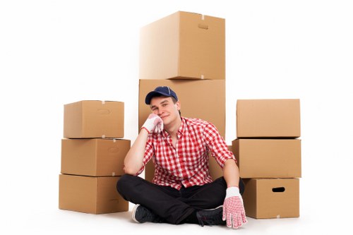 House movers handling furniture in a Peckham property